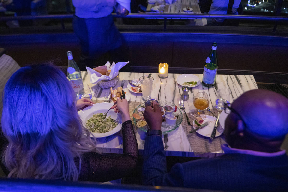 Guests dine at the Top of the World at the Strat on Thursday, Dec. 31, 2020, in Las Vegas. (Eli ...