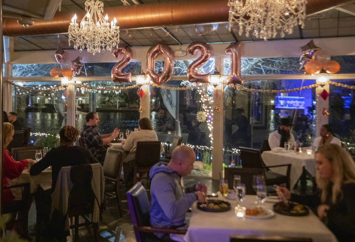 Individuals dine at Americana in Las Vegas on Thursday, Dec. 31, 2020. (Elizabeth Page Brumley/ ...