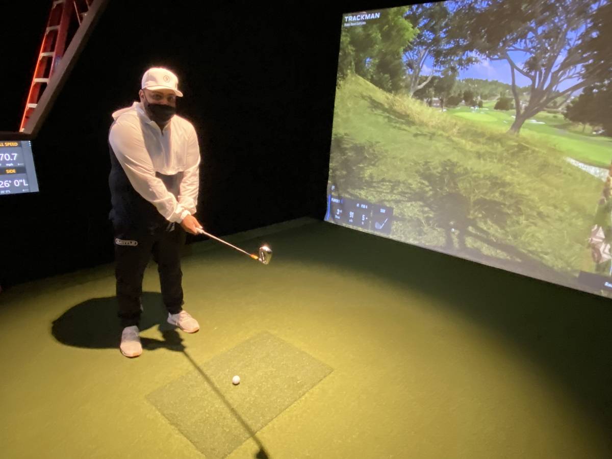 Five Iron Golf General Manager Kenny Ray is shown working out of the rough at the first hole of ...