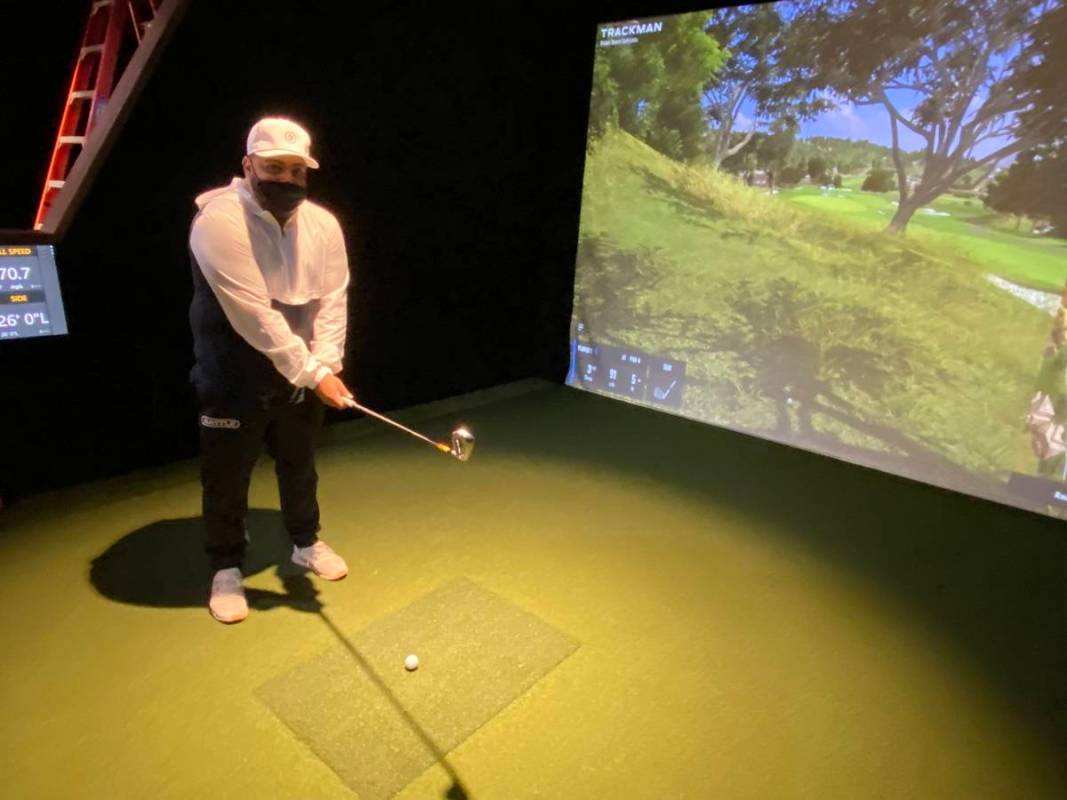 Five Iron Golf General Manager Kenny Ray is shown working out of the rough at the first hole of ...