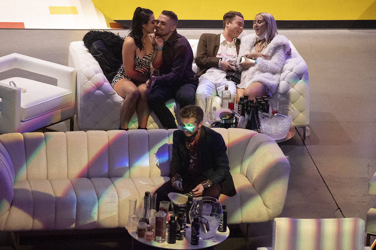 People attend the Illuminate New Year’s Eve celebration at Area 15 in Las Vegas, on Thur ...