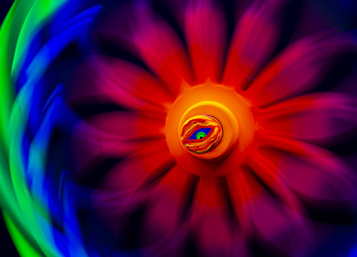 An "Eye Portal" interactive art piece with a spinner is seen in this long exposure ph ...