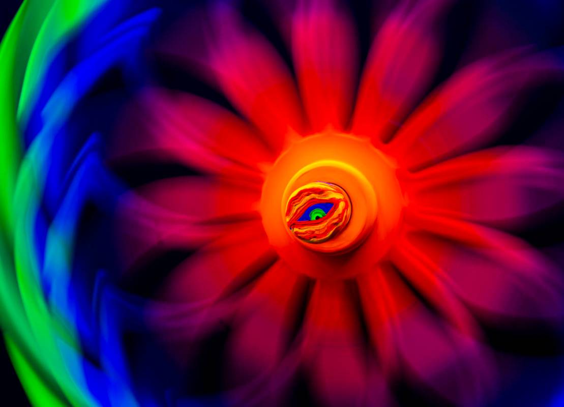 An "Eye Portal" interactive art piece with a spinner is seen in this long exposure ph ...