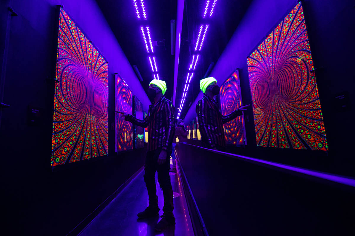 Chris Wink, co-founder of the Blue Man Group and director of content at Area15, points out artw ...