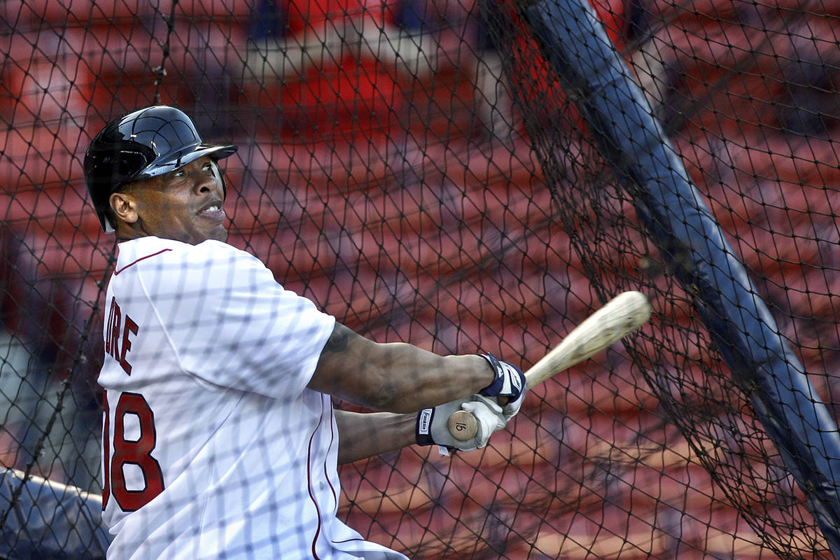 Rapper and producer Dr. Dre takes batting practice at Fenway Park before the opening game of th ...