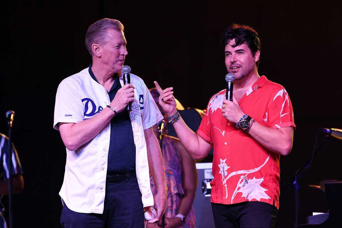 Major League great Orel Hershiser, left, joins Frankie Moreno onstage at The Amp at Craig Ranch ...
