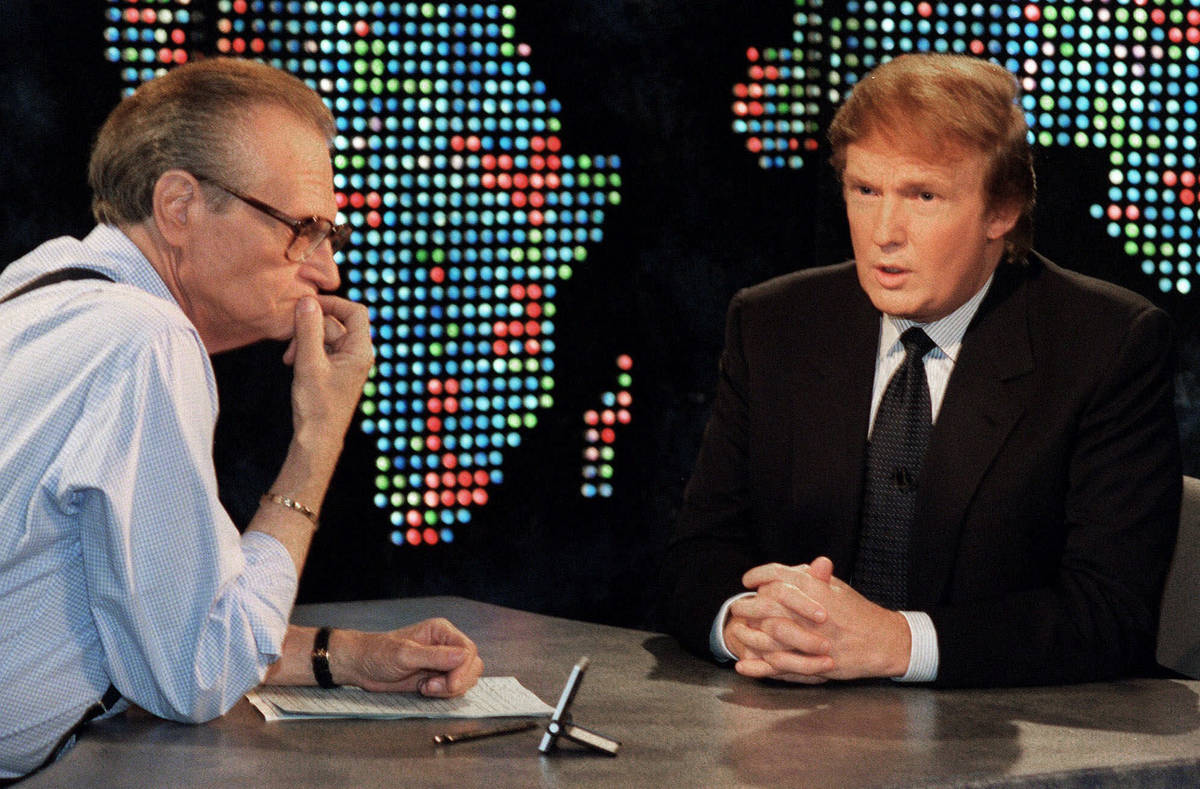 FILE - In this Oct. 7, 1999 file photo, Donald Trump, right, is interviewed by Larry King durin ...