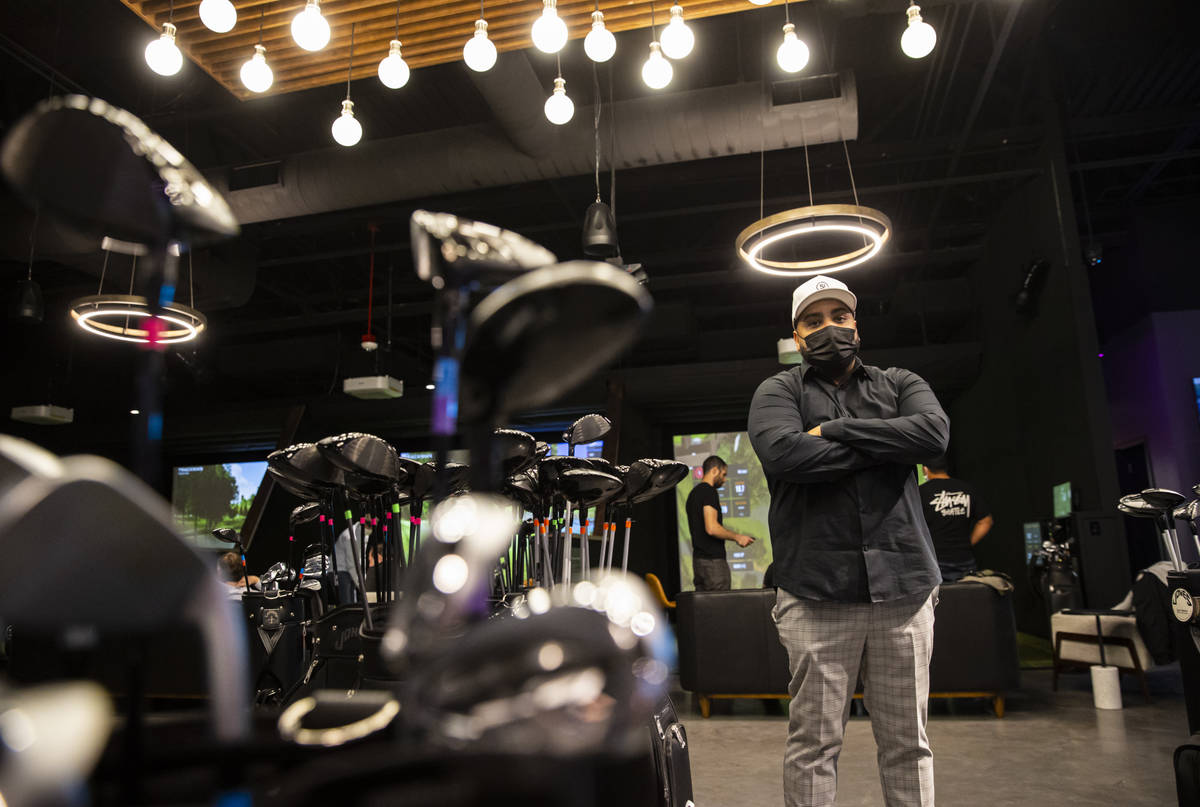 Kenny Ray, general manager at Five Iron Golf, poses for a portrait during a friends and family ...