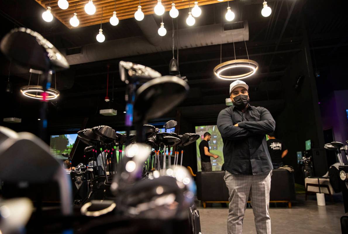 Kenny Ray, general manager at Five Iron Golf, poses for a portrait during a friends and family ...