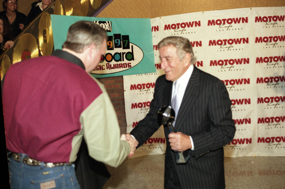 Country music superstar Garth Brooks, left, greets legendary singer Tony Bennett during the eig ...