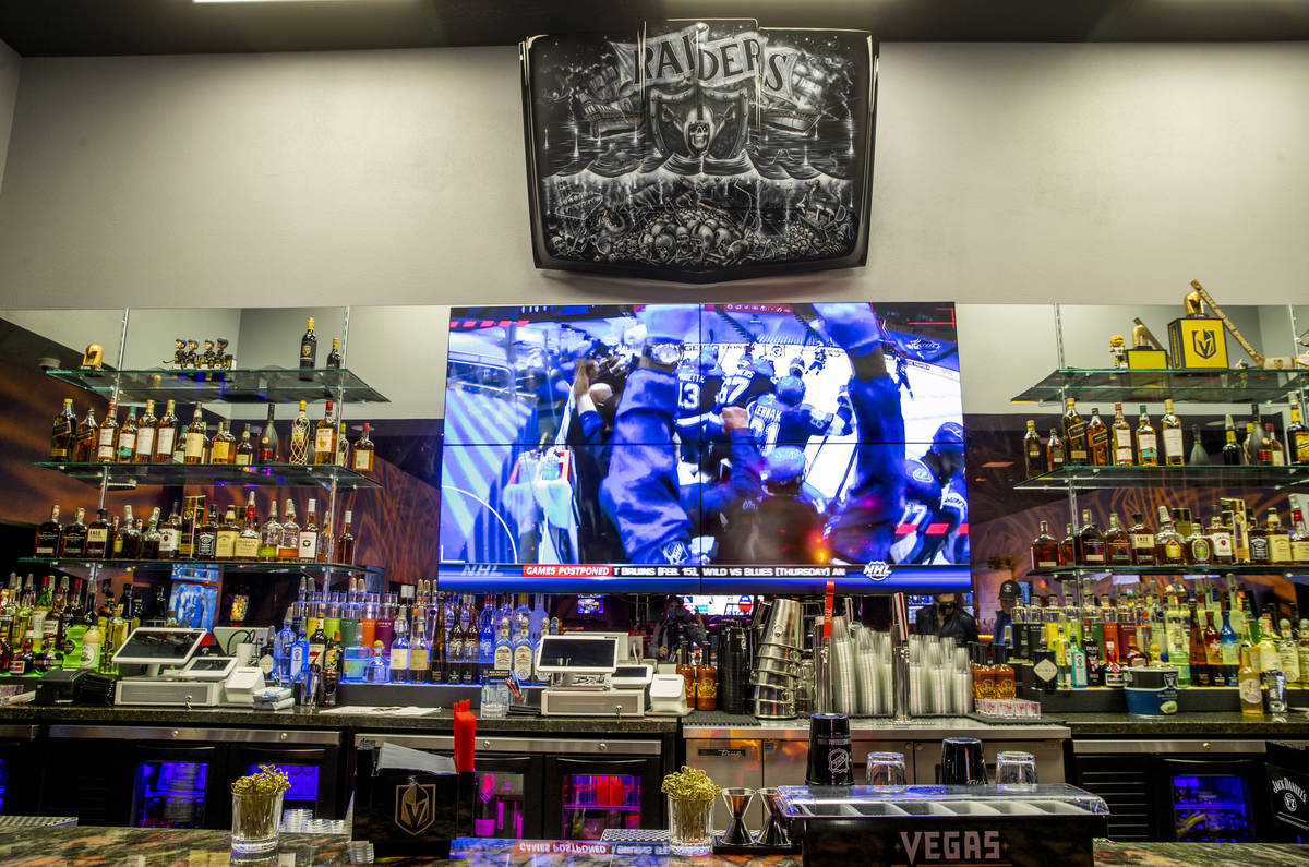 Lighted bar area at the new Diversion Amusements entertainment facility which features a Raider ...
