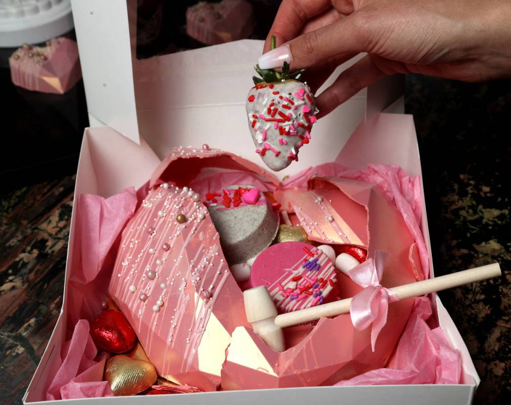 Smashing one of the Heartbreaker Boxes, for sale at The Red Rock Bake Shop inside the Grand Caf ...