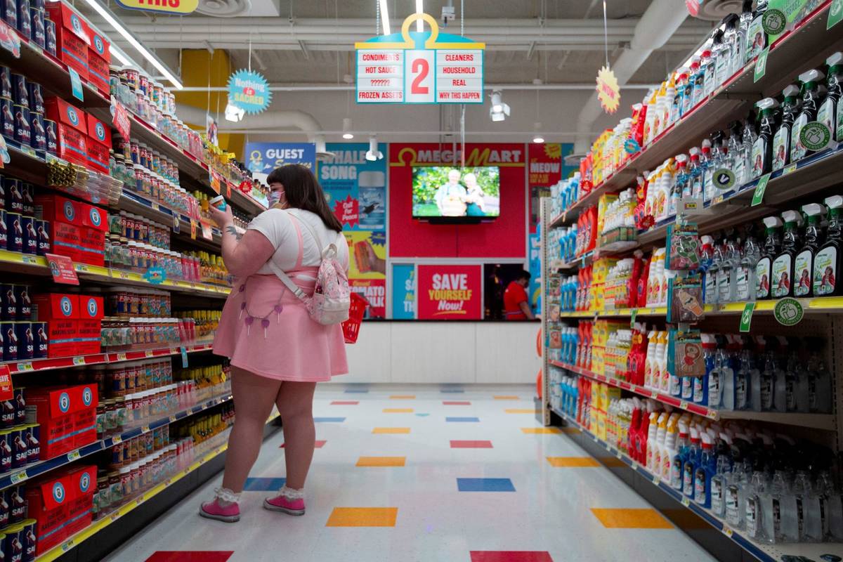 Customers browse the shelves on opening day at the Omega Mart at Area15 on Thursday, Feb. 18, 2 ...