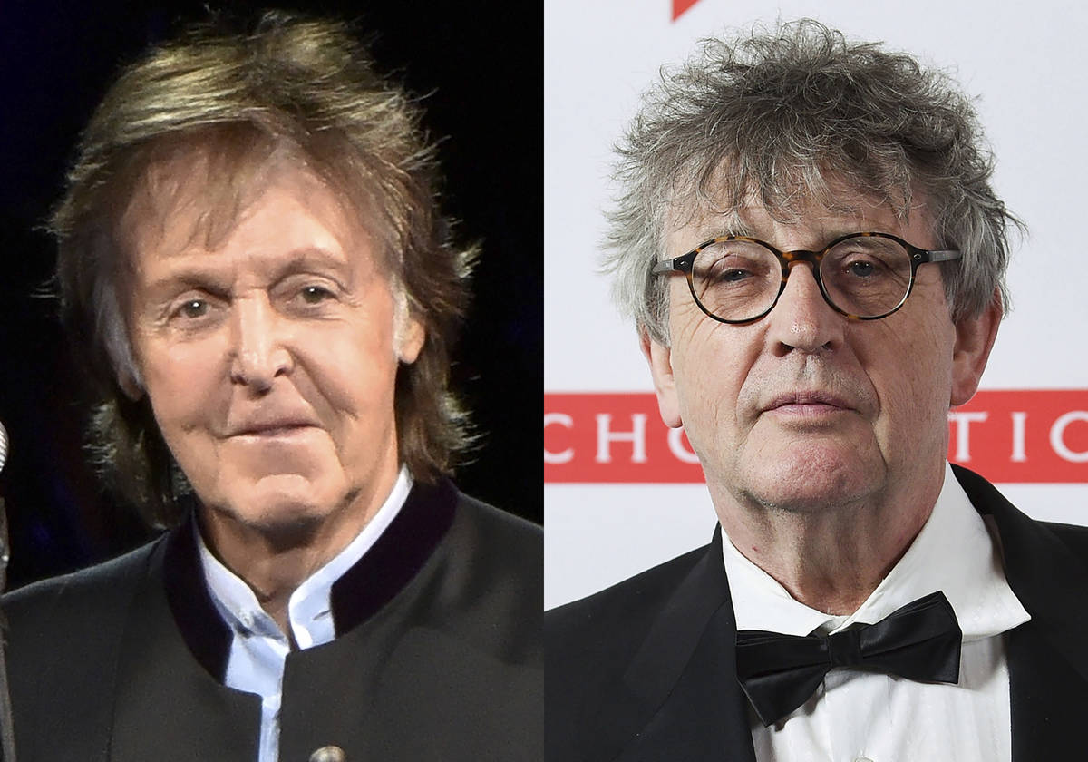 Paul McCartney appears during his One on One Tour in Tinley Park, Ill., on July 26, 2017, left ...