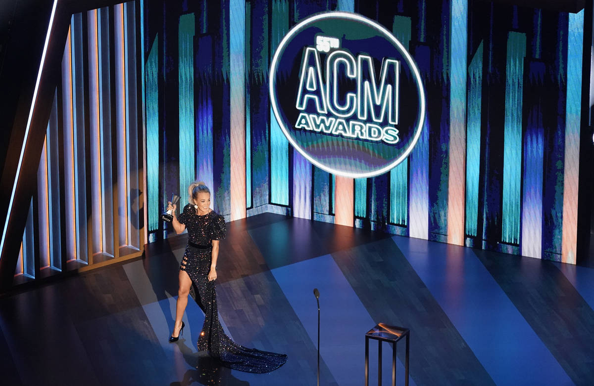 Carrie Underwood accepts the entertainer of the year award in a tie with Thomas Rhett during th ...