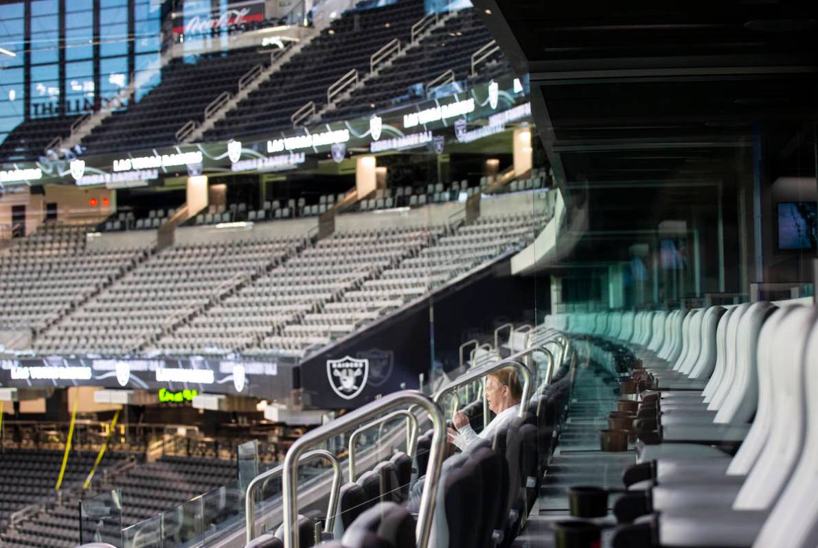Mark Davis, owner of the Las Vegas Raiders, listens as members of Santa Fe & The Fat City H ...