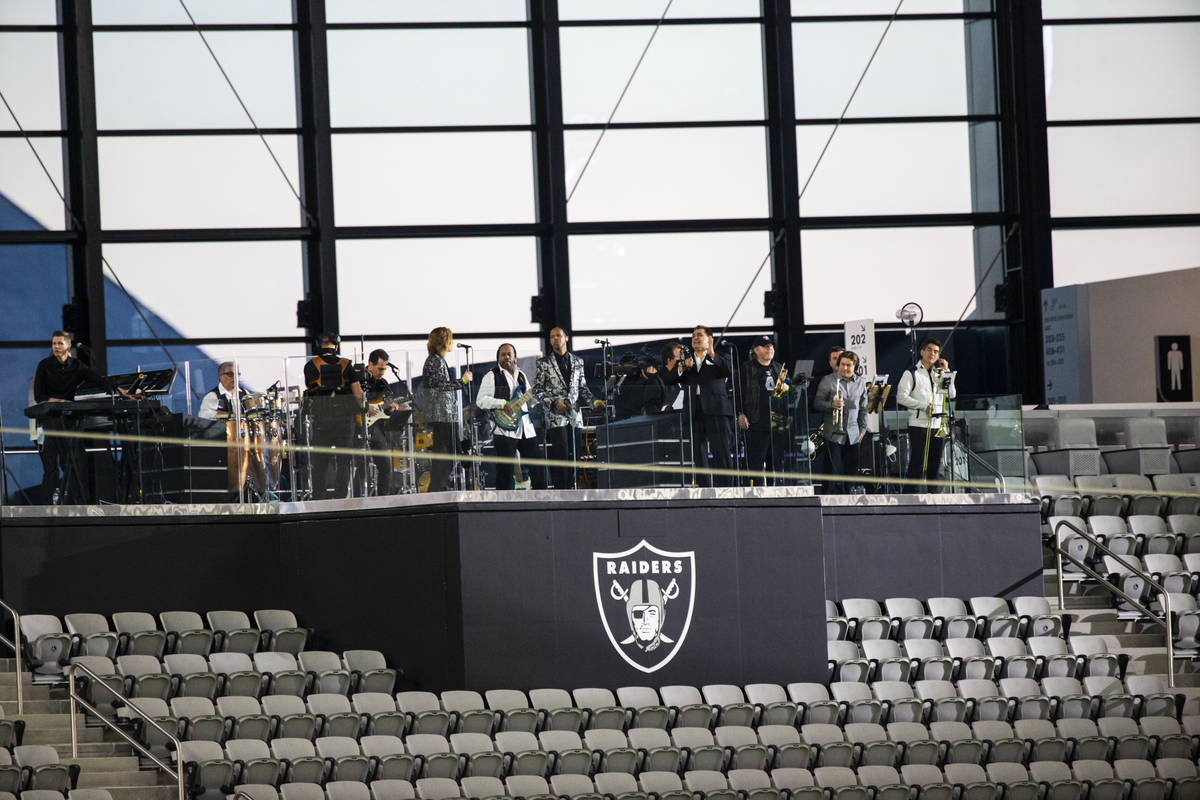 Members of Santa Fe & The Fat City Horns perform at Allegiant Stadium in Las Vegas on Sunda ...