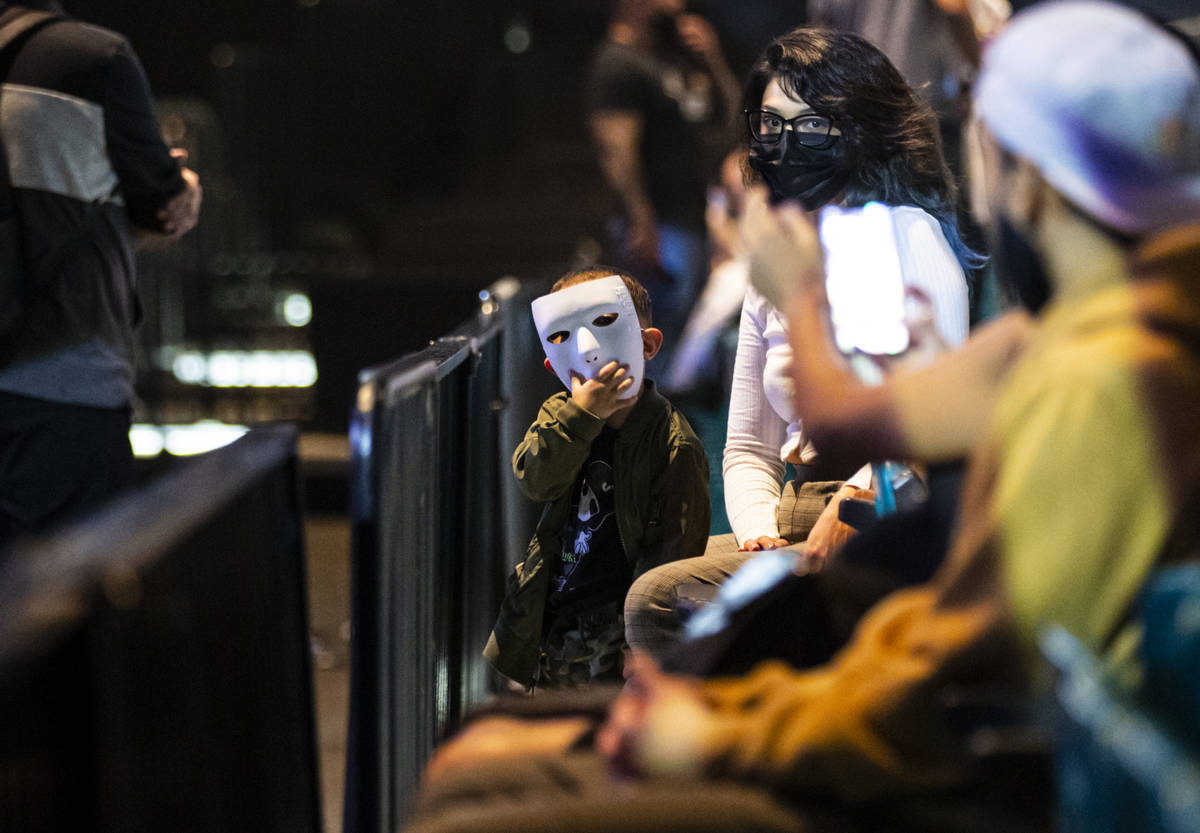People pose in their Jabbawockeez masks before the beginning of the group's new production, &qu ...