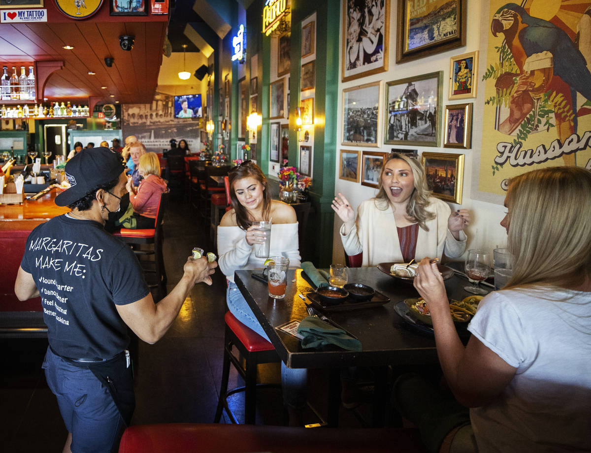 Guests enjoy dinner at Hussong's Cantina Boca Park on March 19, in Las Vegas. (Benjamin Hager/L ...