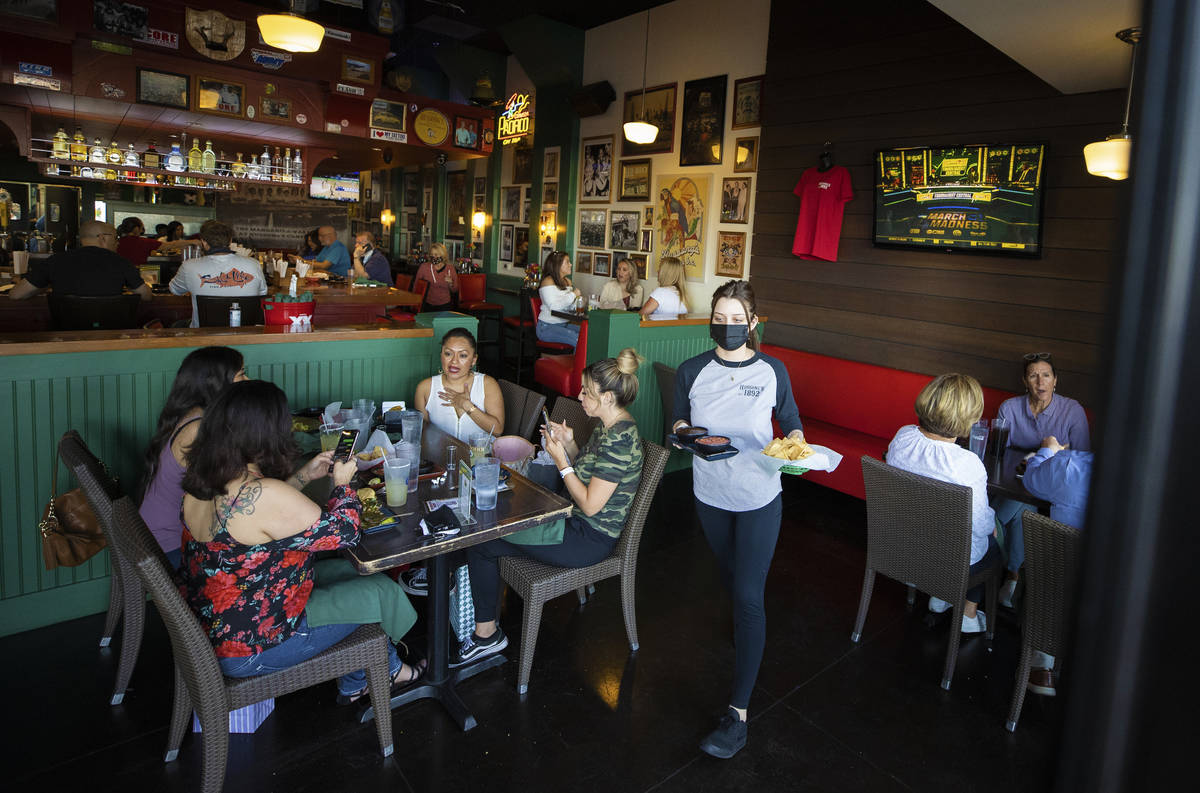 Guests enjoy dinner at Hussong's Cantina Boca Park on Friday. (Benjamin Hager/Las Vegas Review- ...