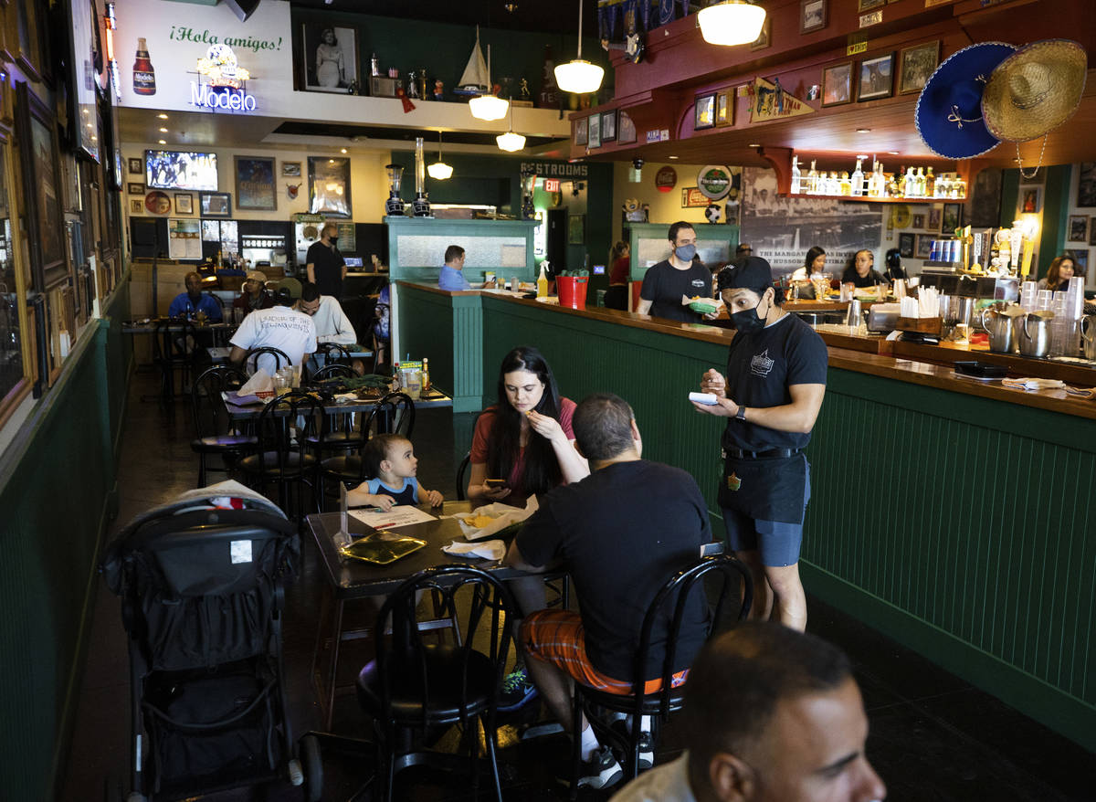 Guests enjoy dinner at Hussong's Cantina Boca Park on Friday. (Benjamin Hager/Las Vegas Review- ...