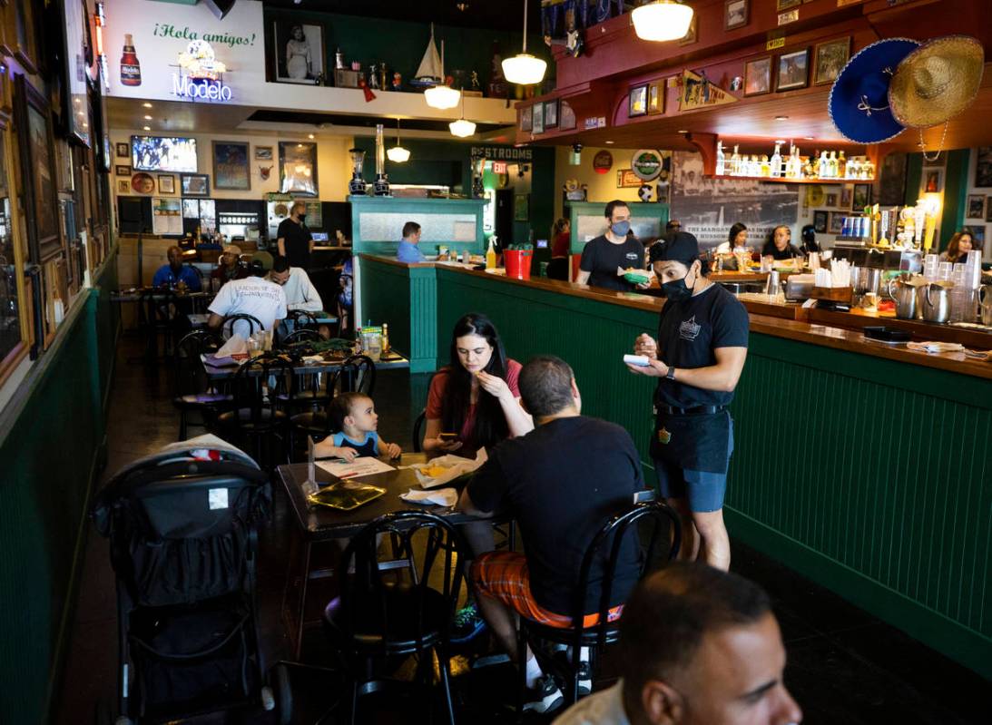 Guests enjoy dinner at Hussong's Cantina Boca Park on Friday. (Benjamin Hager/Las Vegas Review- ...