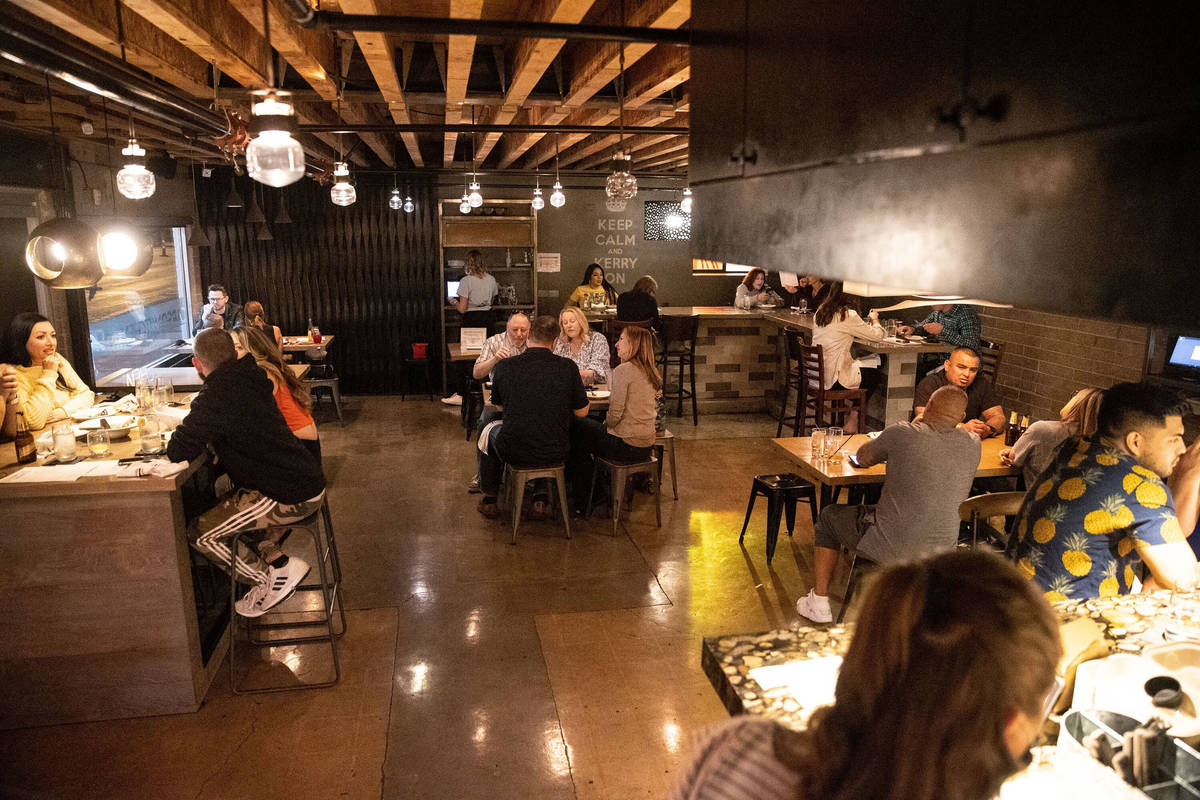 People dine downtown at Carson Kitchen in Las Vegas on March 19. (Erik Verduzco / Las Vegas Rev ...