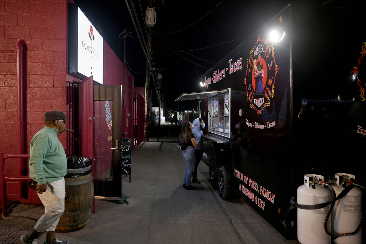 People arrive on reopening night at Cork and Thorn in downtown Las Vegas Sunday, March 21, 2021 ...