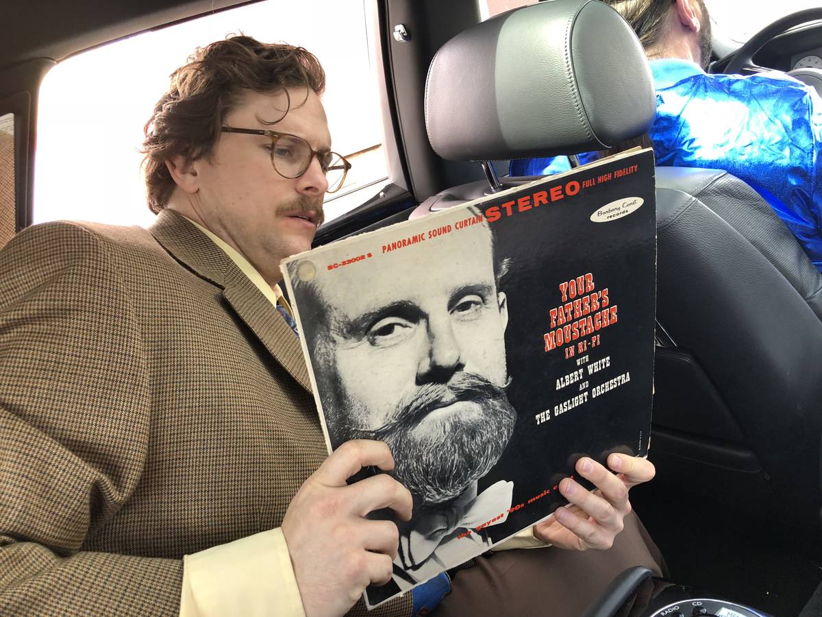 Harry M. Howie of "Opium" at the Cosmopolitan of Las Vegas flips through his vintage-album coll ...