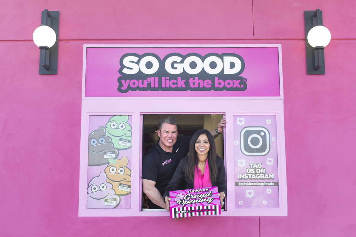 Pinkbox Doughnuts owners Stephen Siegel and Judith Siegel in the drive-thru of their new store ...