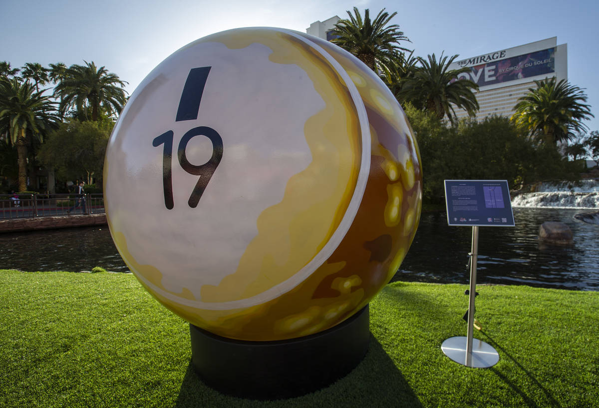A 200-pound bingo ball by artist Jerry Misko is displayed in front of The Mirage Volcano on Tue ...