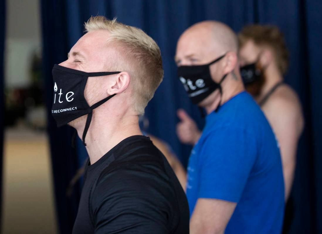 Banquine acrobat Adam Denny, left, shares a laugh with fellow performers during rehearsal for " ...