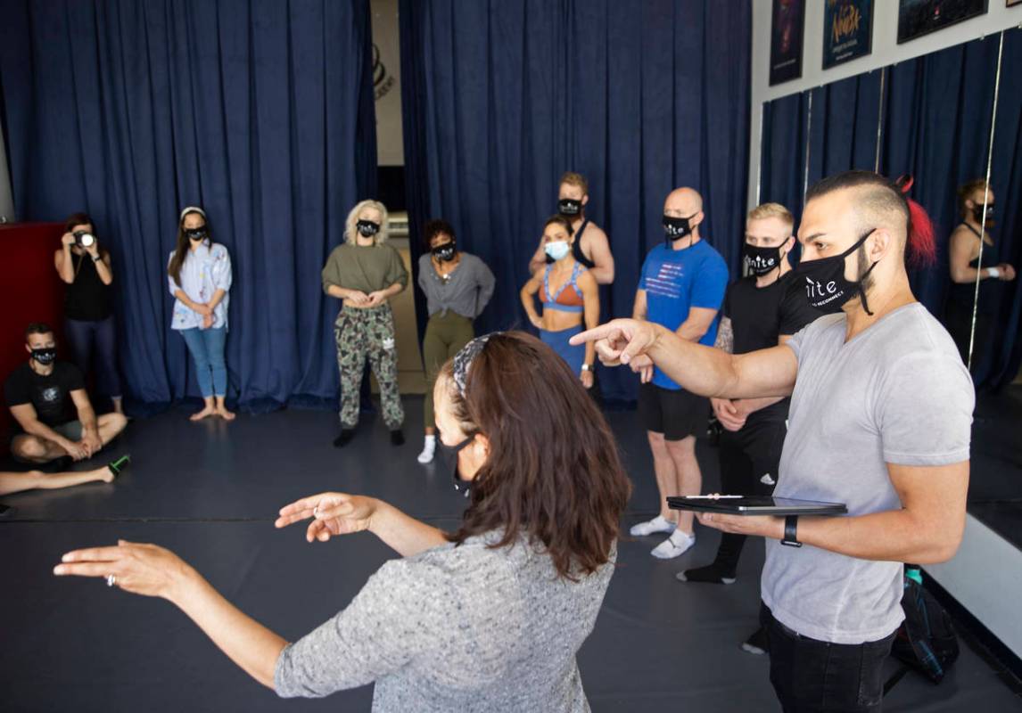 Brandon Pereyda, right, leads a meeting during rehearse for "Ignite" at Nevada Rhythmic Academy ...