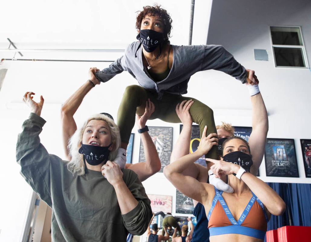 Allison Burke, bottom/left, Tiffany de Alba, Marina Pegado and Wyatt Hopkins rehearse for "Igni ...