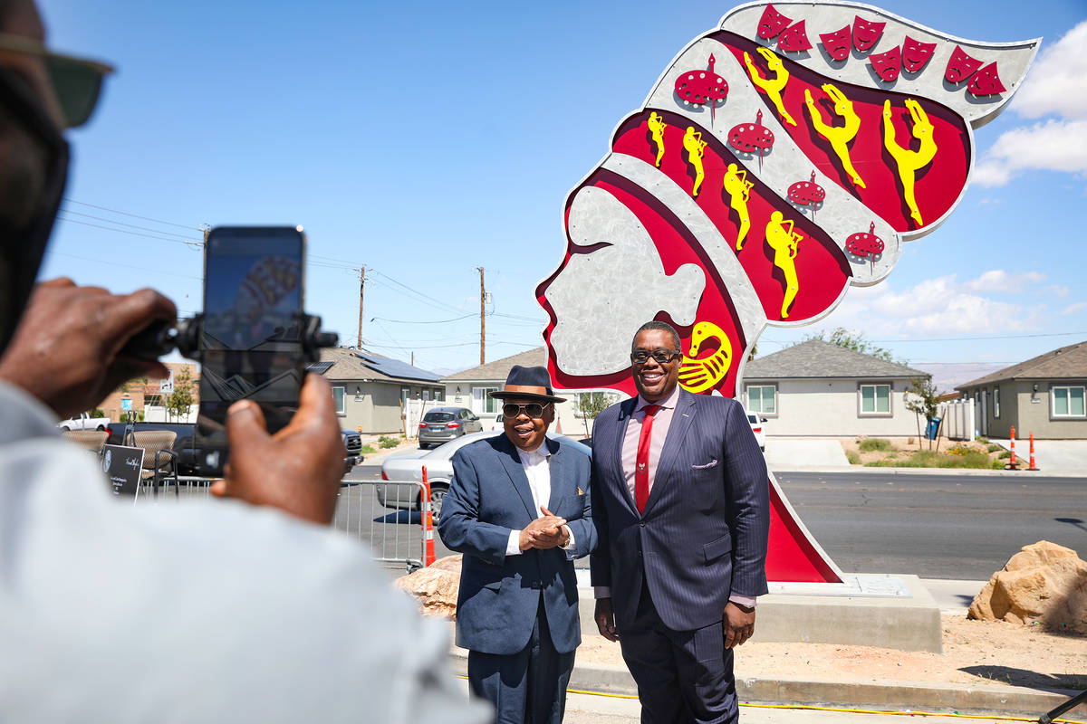 Lou Collins, left, takes a photo alongside Las Vegas City Councilman Cedric Crear, right, in fr ...
