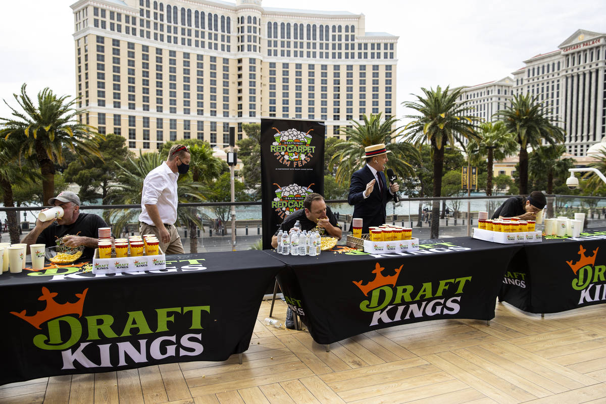 Geoff Esper, from left, Joey Chestnut, and Matt Stonie compete in the World Popcorn Eating Cham ...