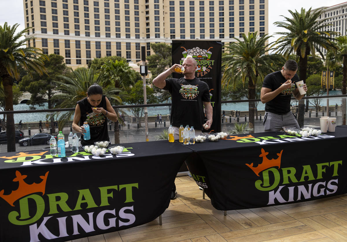 Michelle Lesco, from left, Nick Wehry and Matt Hazzard compete to eat 50 hard boiled eggs durin ...