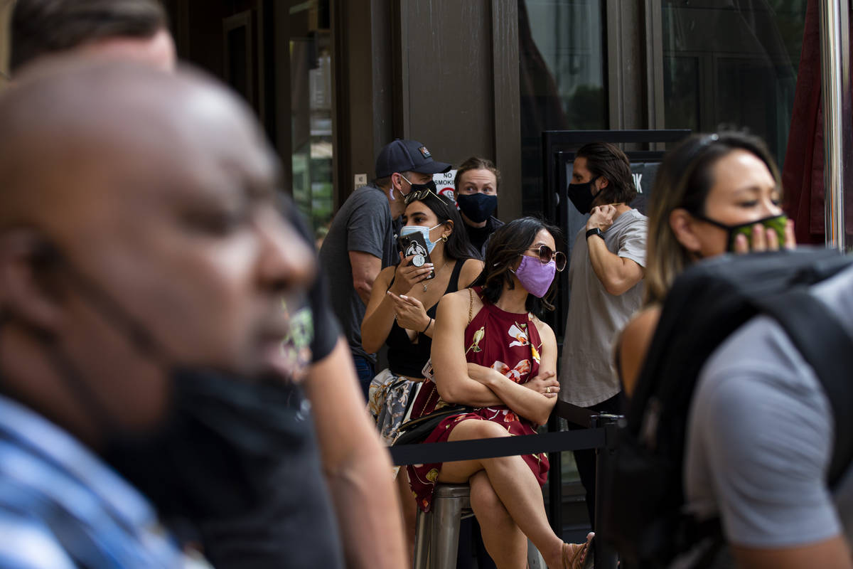 People watch the World Popcorn Eating Championship during the "Red Carpet Film Feast" ...