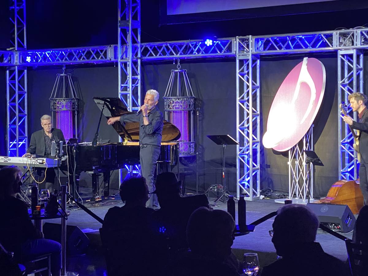Clint Holmes performs with Tom Schuman, far left, and Dave Ostrem at Notoriety at Neonopolis on ...