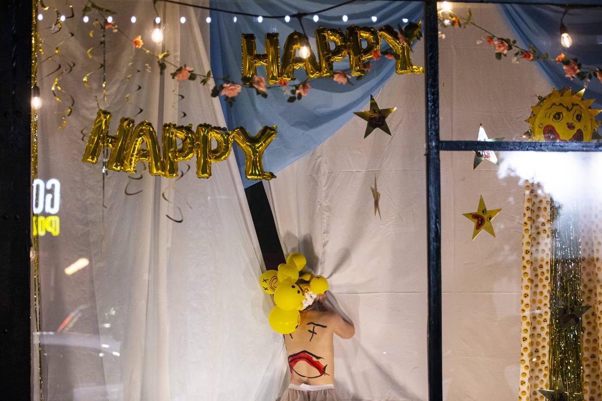 Heidi Rider performs from the windows of the Majestic Repertory Theatre in the Arts District of ...