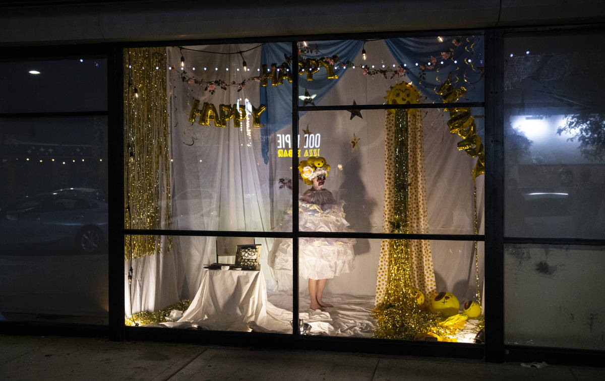 Heidi Rider performs from the windows of the Majestic Repertory Theatre in the Arts District of ...