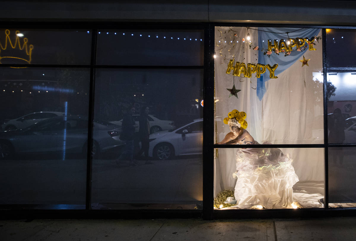 Heidi Rider performs from the windows of the Majestic Repertory Theatre in the Arts District of ...