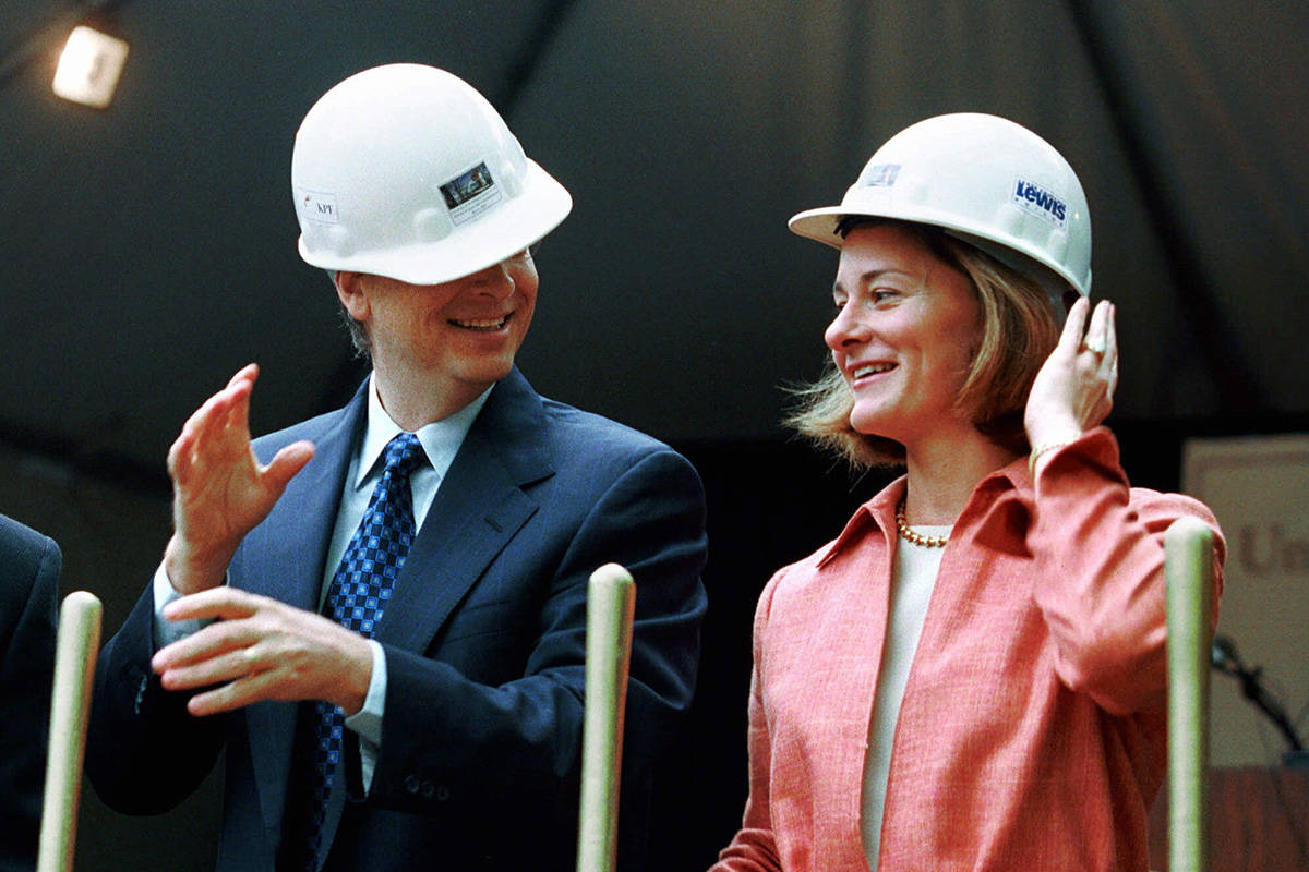 FILE - In this May 4, 2001, file photo, Microsoft Chairman Bill Gates contends with an ill-fitt ...