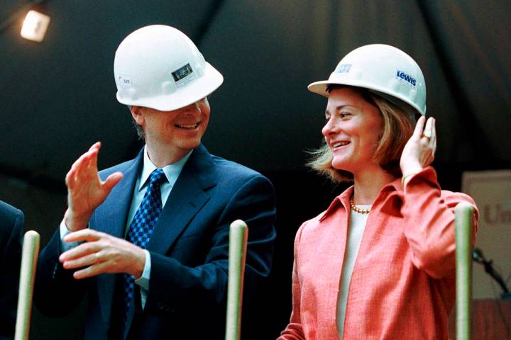 FILE - In this May 4, 2001, file photo, Microsoft Chairman Bill Gates contends with an ill-fitt ...