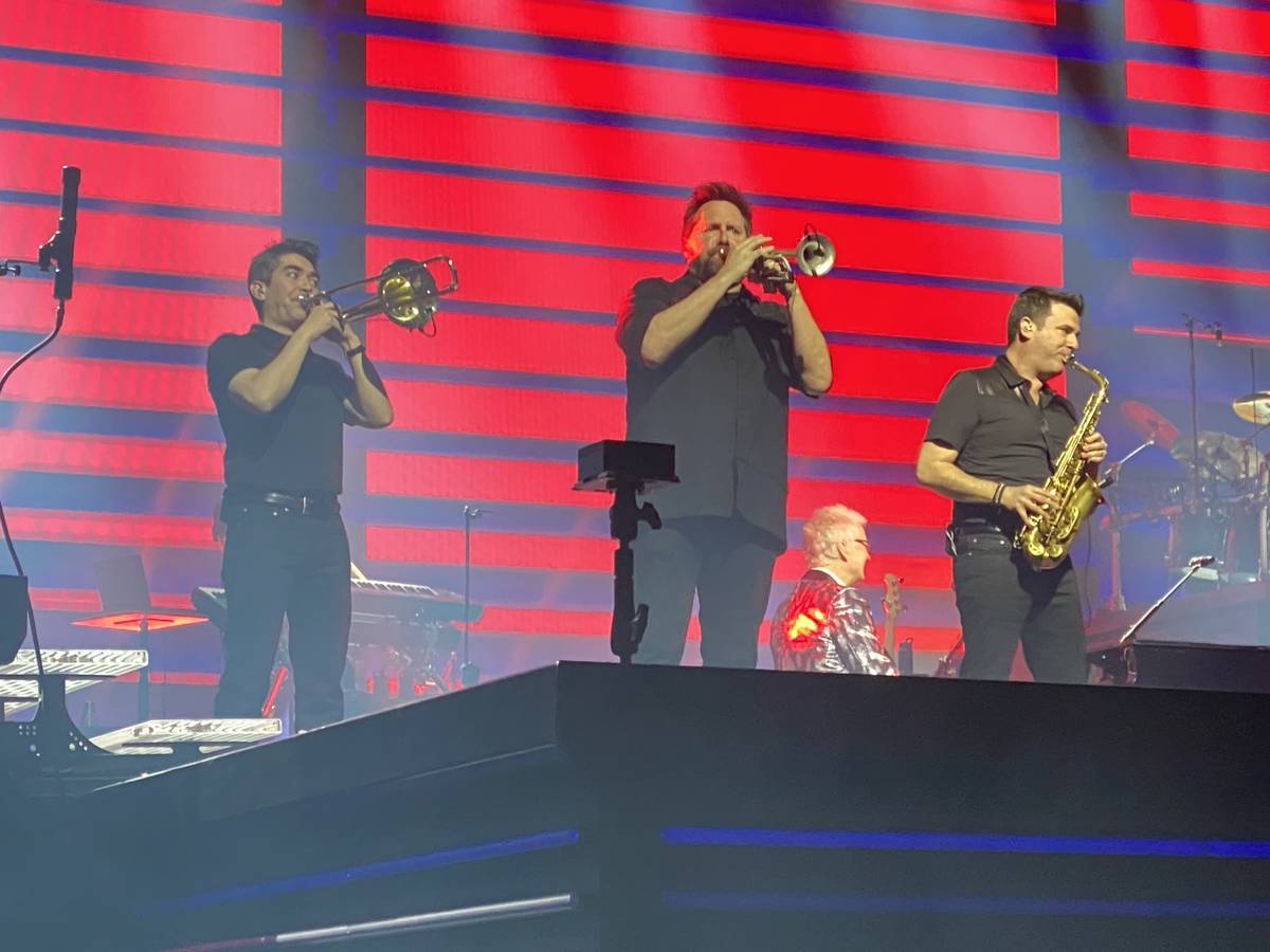 Nathan Tanouye, Matt Fronke and Eric Tewalt are shown performing with Celine Dion at Bridgeston ...