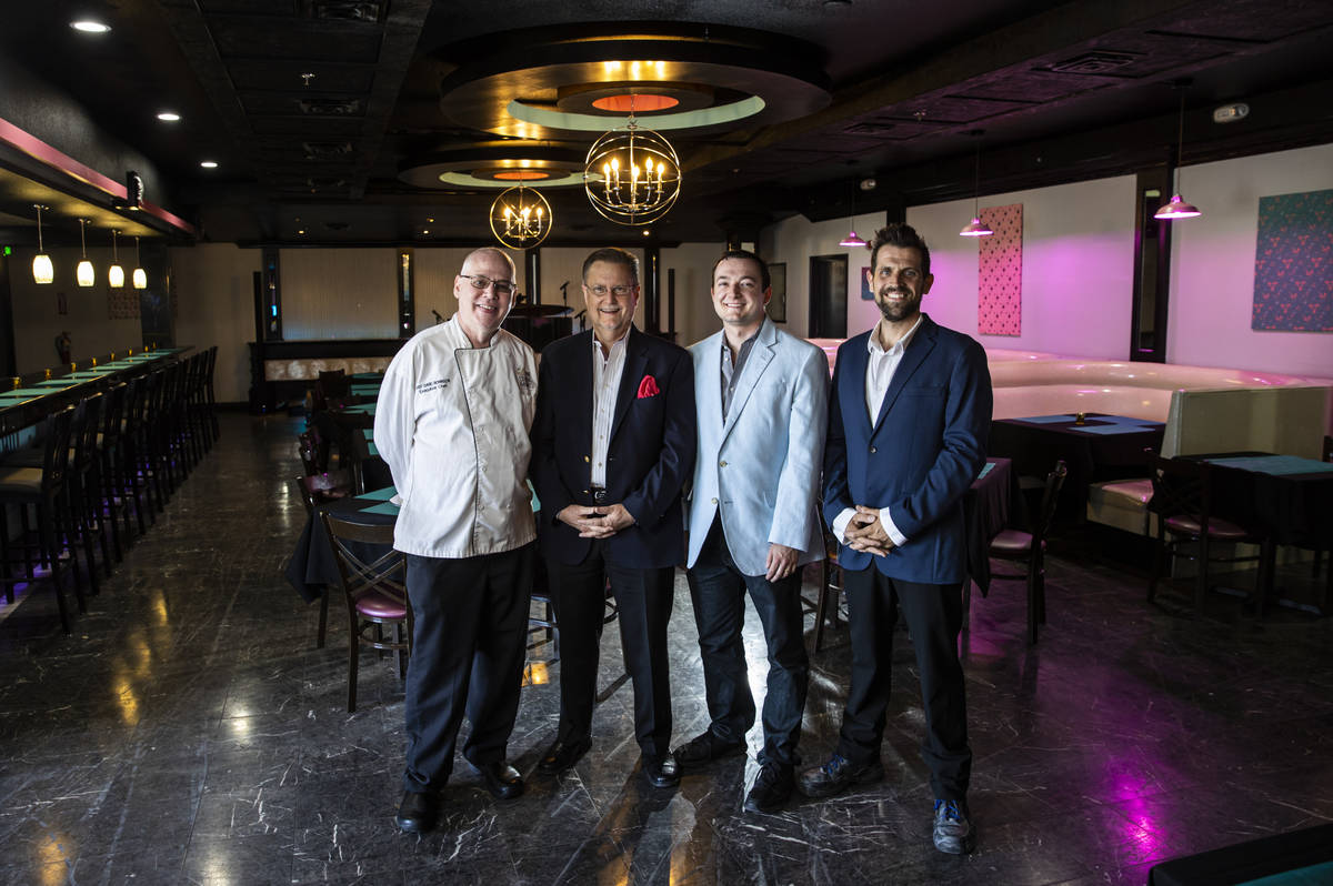 Chef David Robinson, owner of The Nevada Room, from left, poses with president Tom Michel, vice ...