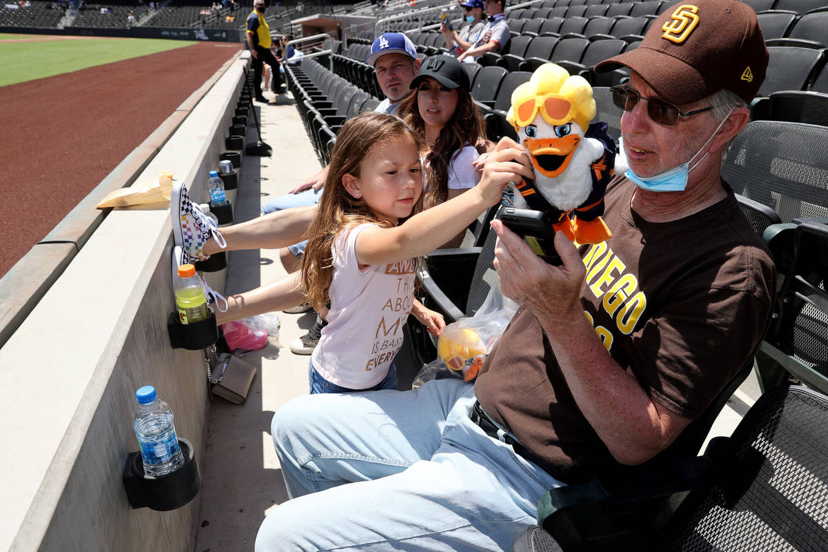 David Bentley makes a video call as his granddaughter Kacey, 5, shows the plush toy he bought h ...