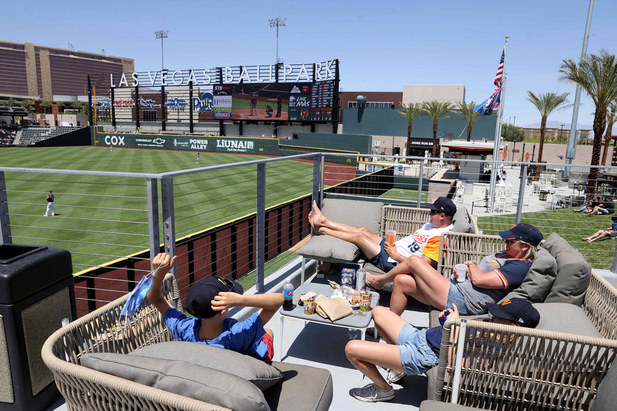 Clayton Nelson, his wife Cari, daughter Brooke, 10, and son Grant, 9, left, watch the Aviators ...