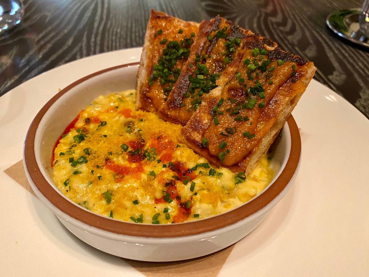 Scrambled eggs with roasted garlic, bottarga (cured fish roe) and tomato toast at Amalfi. (Al M ...