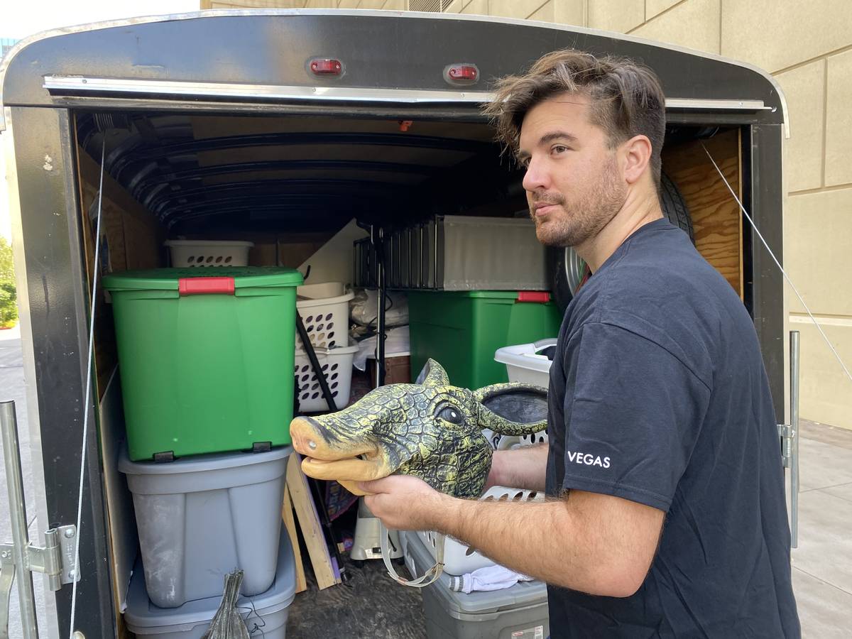 Luke Striffler, who played Ross in "Friends: A Musical Parody" is shown packing up his prop arm ...